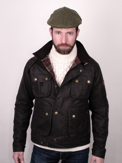 Man in motoring jacket and flat cap